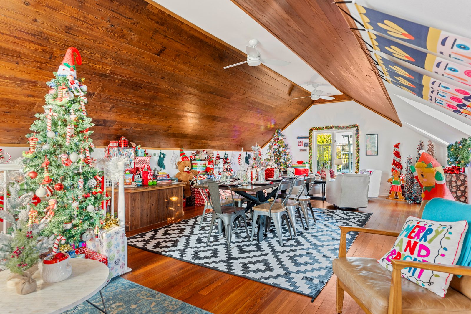 Loft upstairs with multiple Christmas trees